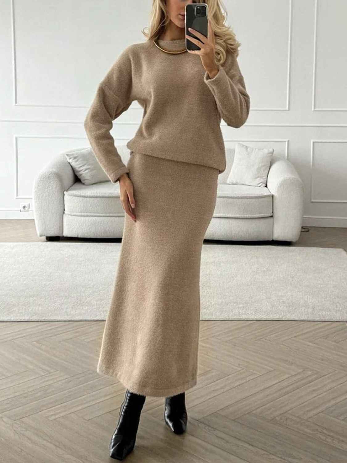 Woman wearing The Polished Knit Duo, a round-neck knit top and matching midi skirt sweater set from HOORR