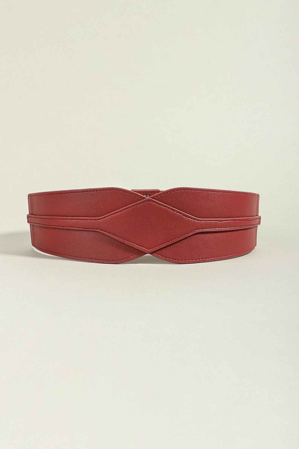 Wide elastic belt styled over a flowy summer dress