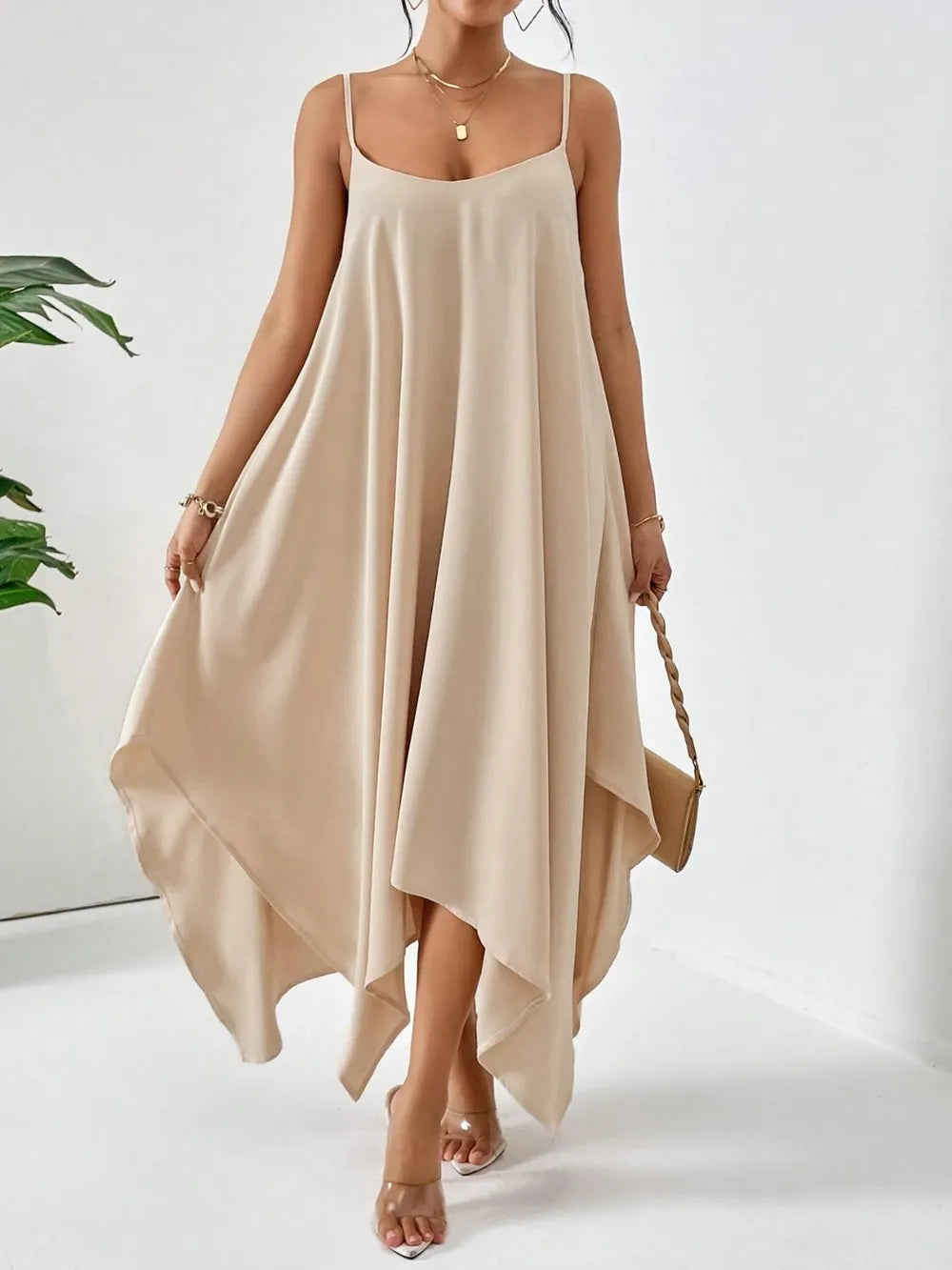 Woman wearing a scoop neck midi cami slip dress from HOORR, styled for summer