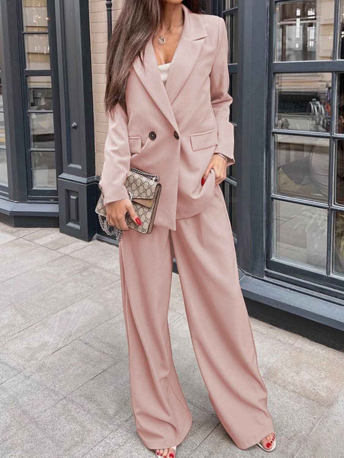 Woman wearing The Power Set, an apricot buttoned lapel blazer and wide-leg trouser set