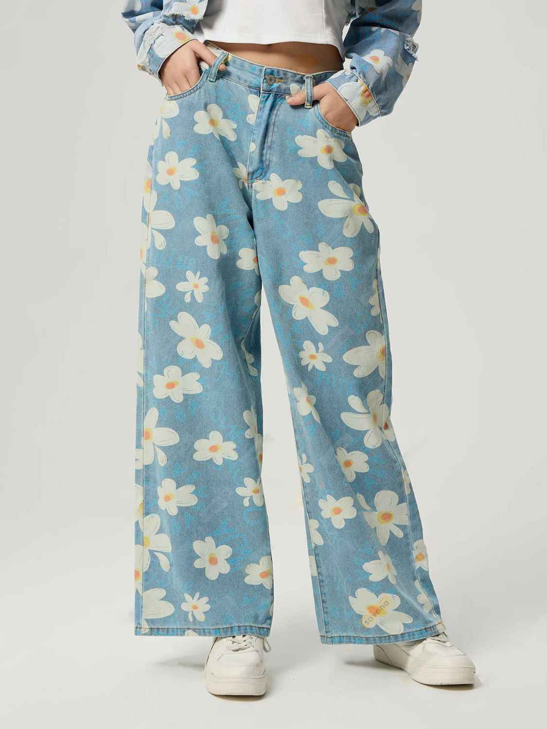 Woman wearing HOORR Floral Wide Leg pocketed jeans styled with a fitted top